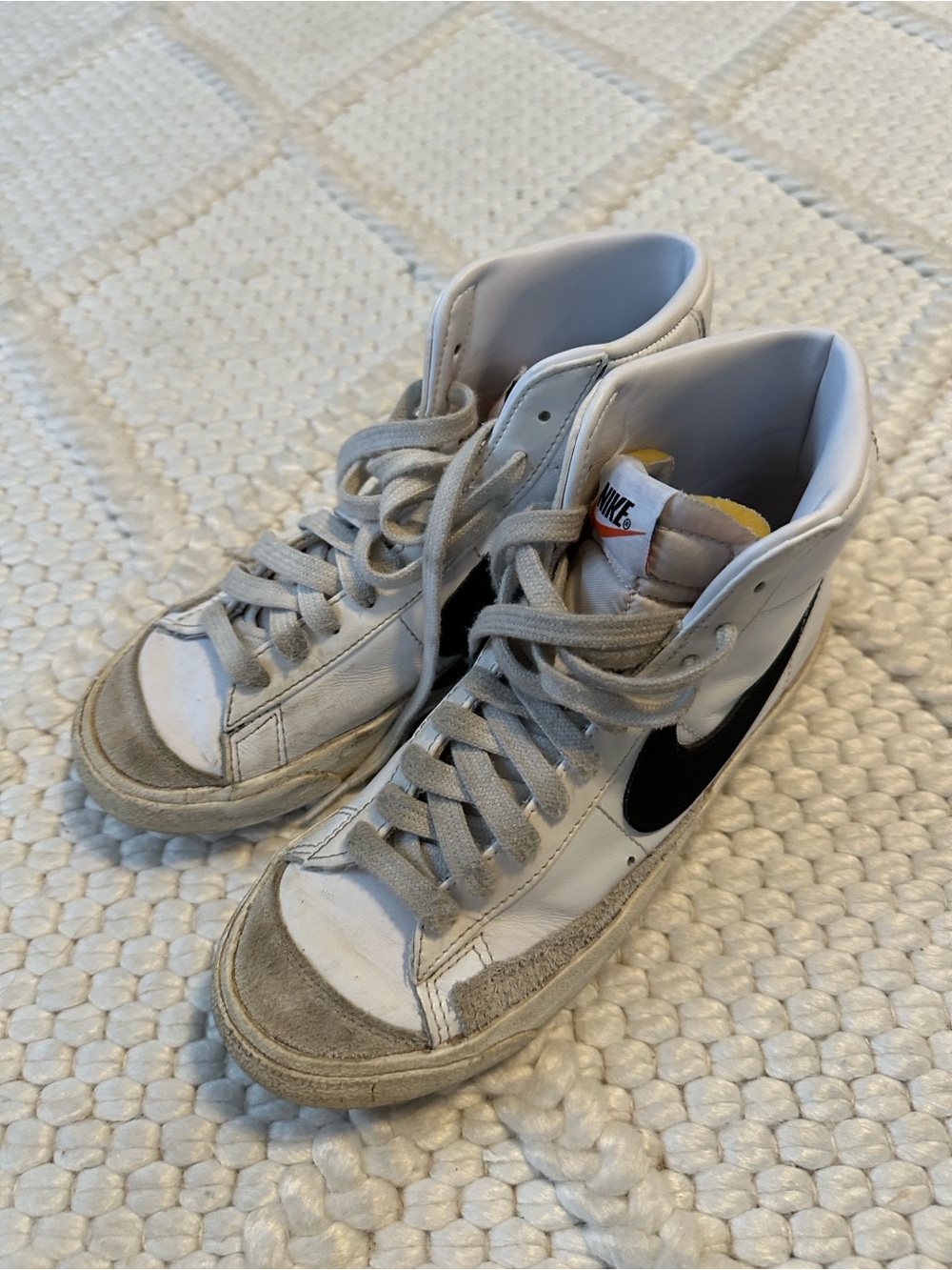 Nike White High-Top Sneakers with Black Swoosh
